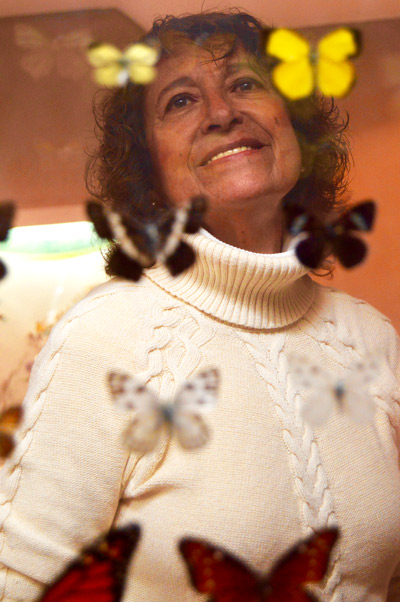 Retrato de Maria Eugenia Diaz Batres con mariposas de Chapultepec